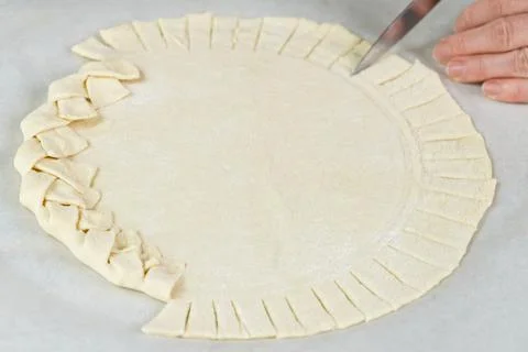 Pizza making process. Top view of pizza dough base. Home-baking pizza with a Stock Photos