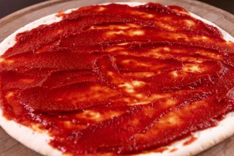 Pizza making process. Top view of pizza dough base. Home-baking pizza with a  Photos