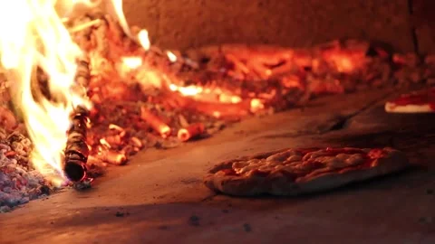 Pizza Margherita pulled out of the stone oven Stock Footage 134556121