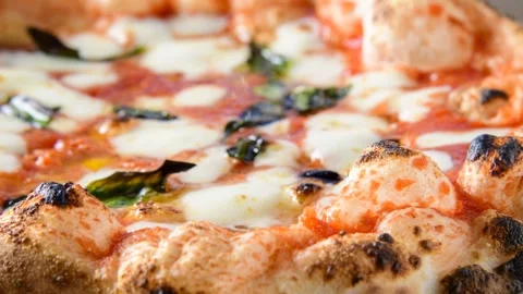Pizza With Melted Cheese And Basil, Close-Up Shot Stock Footage 343694019