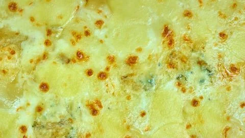 Pizza with melted cheeses of different types Фото