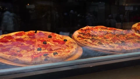 Pizza outside the restaurant window Stock Footage 260087037