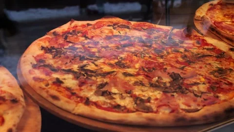 Pizza outside the restaurant window Stock Footage 260087304