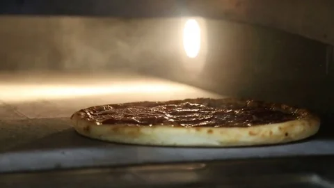 Pizza in the oven Stock Footage 83546032