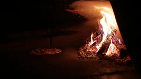 Pizza oven roasted by the fire Stock Footage 44219051