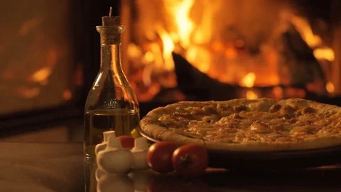 Pizza over fireplace background. Stock Footage 82542586