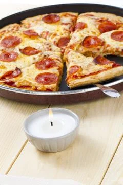 Pizza on pan with spatula Stock Photos