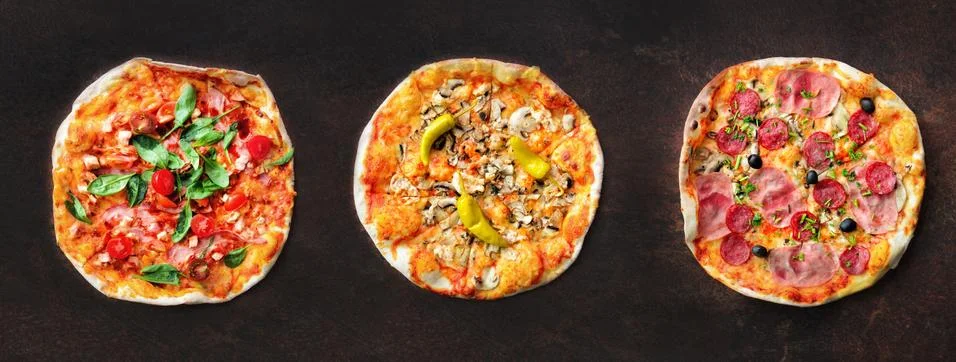 Pizza pattern. Three pieces set on dark background. Top view, copyspace Stock Photos