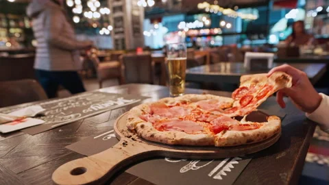 Pizza pepperoni cozy restaurant setting delicious on wooden board Stock Footage 292542683