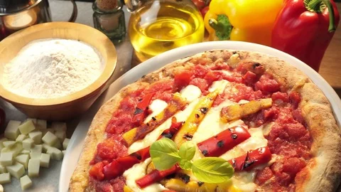 Pizza with peppers  on the kitchen table 스톡 동영상 85595670