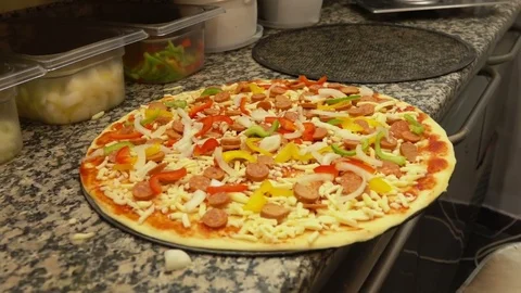 Pizza is placed in the oven Stock Footage 70809688