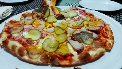 Pizza on a plate with bacon, cheese, garlic and barbecue sauce, close-up Video stock 297850185