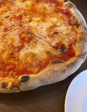 Pizza on a plate close-up Stock Photos