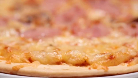 The pizza is on the plate. Close up. Slider Stock Footage 100742249