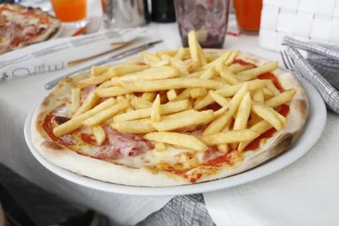 A pizza with potatoes Stock Photos