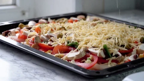 Pizza preparing adding cheese close up footage Stock Footage 84099000