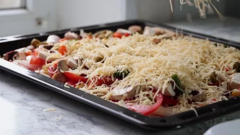 Pizza preparing adding cheese close up footage Stock Footage 84099040