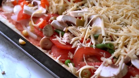 Pizza preparing adding cheese close up footage Stock Footage 84099828