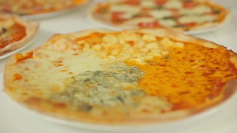 Pizza presentation. Slider panorama from four cheeses pizza to capricious. 動画素材 78684330
