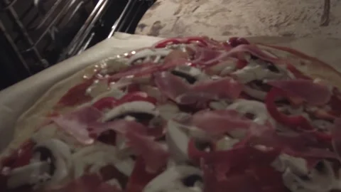 Pizza put into oven Stock Footage 169354523