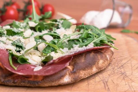 Pizza with raw ham Stock Photos