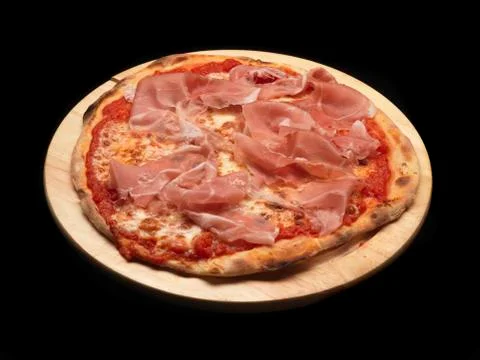Pizza with raw parma ham Stock Photos