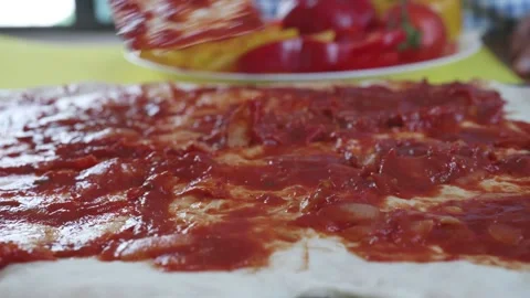 A pizza with red sauce on it Stock Footage 314996369