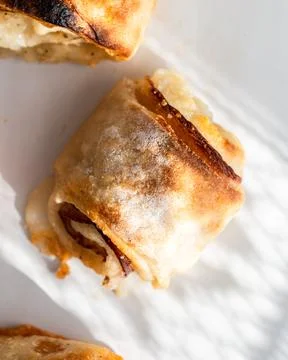 Pizza rolls with nice rays of light on a white background Stock Photos