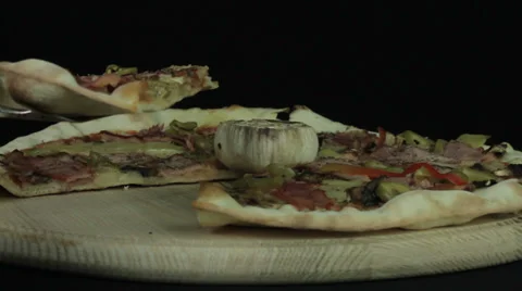 Pizza is rotated on a black background Stock Footage 35347978