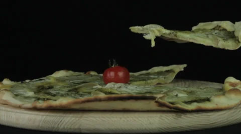 Pizza is rotated on a black background loop Stock Footage 35148973