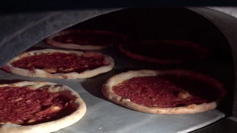 Pizza rotates in the oven Stock Footage 82669013