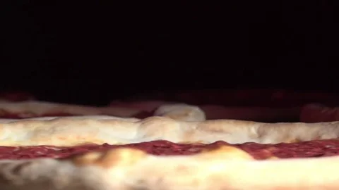 Pizza rotates in the oven Stock Footage 83372357