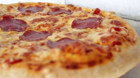 Pizza rotating on table, from above, top view Stock-Footage 72458819