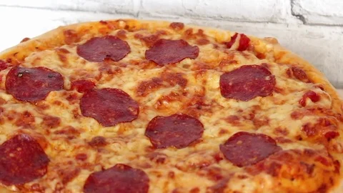 Pizza rotating on table, from above, top view Stock-Footage 72458837