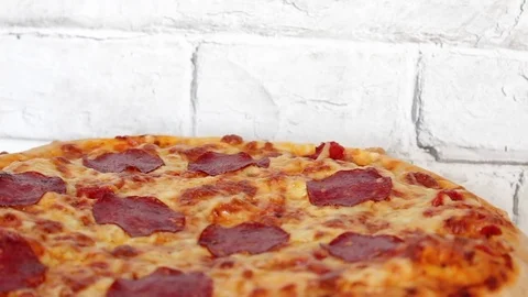 Pizza rotating on table, from above, top view Stock Footage 72458838