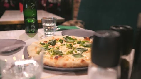 Pizza served in a restaurant. Close-up. The served table. Stock Footage 138487845