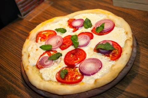 Pizza in shape of circle Stock Photos