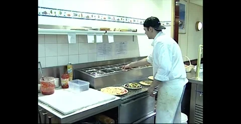 Pizza Shop Kitchen and Man Making Pizza – Australia (1991) Stock Footage 318824219