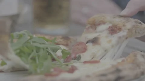 Pizza slice being pulled, cheese stretching, tomatoes Stock Footage 202132952
