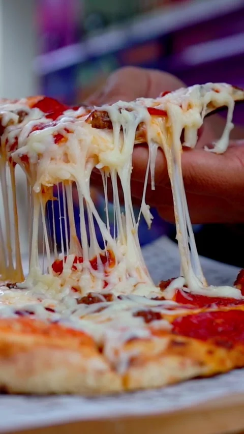 Pizza slice with cheese stretching Stock Footage 298725460