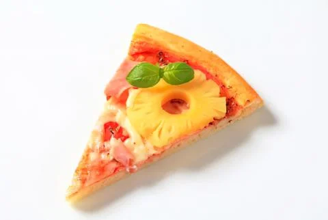 Pizza slice with pineapple and basil garnish Stock Photos