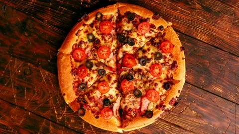 Pizza sliced on the table Stock Footage 144204915