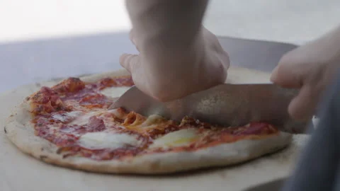 Pizza slicing Stock Footage 285558338