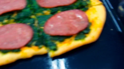 Pizza with spinach is placed on the table. Close-up. Stock-Footage 125222084