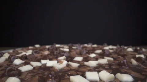Pizza surface on table chocolade macro closeup slide out Stock Footage 124017652
