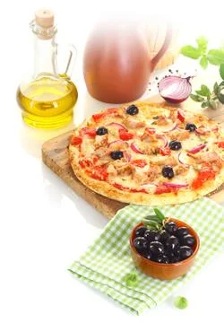 Pizza surrounded by the ingredients Stock Photos