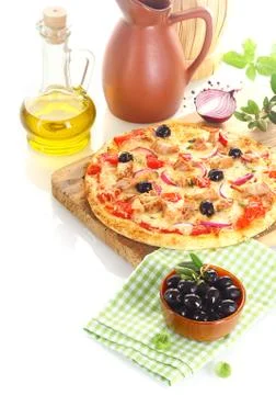 Pizza surrounded by the ingredients Stock Photos