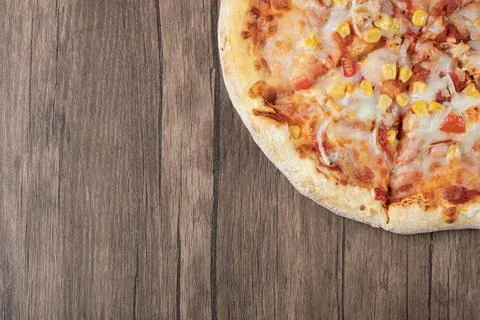 Pizza in tomato sauce with marinated corn seeds and melted cheese on the top Stock Photos