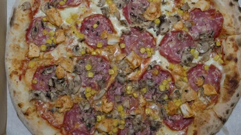 Pizza top view close up for restaurant menu background with salami mushrooms Stock Footage 336460403