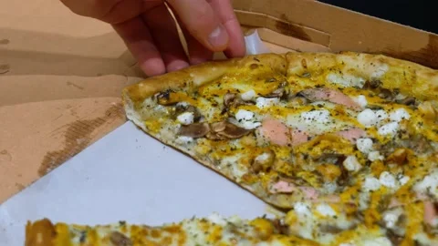 Pizza top view. Hands pick up pieces of hot pizza close-up slow mo Stock Footage 171152657